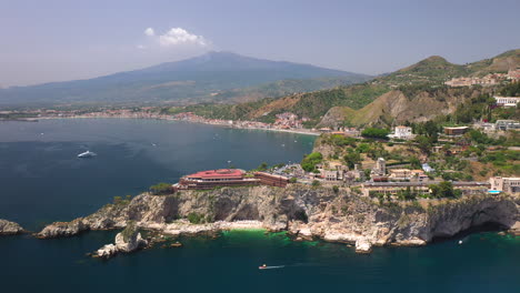 Drone-shot-of-the-Isola-Bella-coastline-with-the-Ionian-Sea