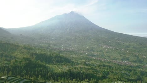 Merapi-volcano-with-rural-view-of-vegetable-plantation-and-dense-of-trees,-central-java,-Indonesia