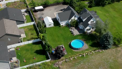 Aerial-shot-of-a-private-home-with-an-above-ground-pool