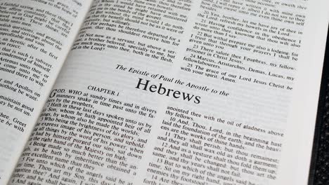 Close-Up-Shot-of-Bible-Page-Turning-to-the-book-of-Hebrews