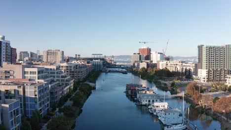 Wide-rising-aerial-shot-looking-down-the-Mission-Creek-Channel-towards-Mission-Bay-in-San-Francisco