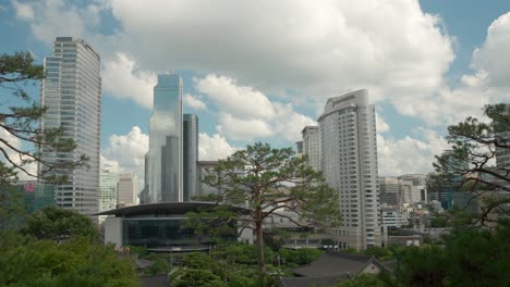 WTC-Seoul-Trade-Tower-and-Coex-Convention-and-Exhibition-Center,-Intercontinental-Hotel-and-Asem-Tower-building-exteriors---clouds-time-lapse