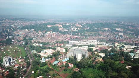 Kampala-aerial-cityscape-of-the-capital-of-Uganda,-highway-and-developed-housing-and-commercial-area