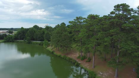 Drone-Shot-of-Lake-and-Trees-in-Georgia-Park-on-Overcast-Day