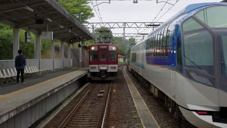 Japanese-Local-Train-arrives-at-platform-next-to-Shimakaze-liner-at-Kashikojima