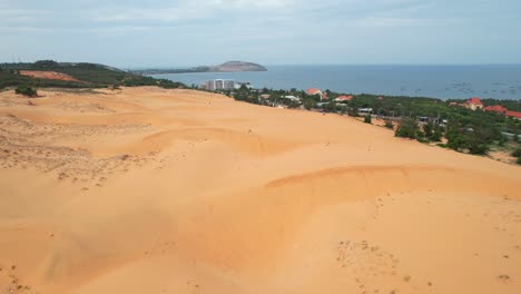 aerial-of-golden-wavy-ripples-in-the-sand-dune-desert-of-Mui-Ne-Vietnam