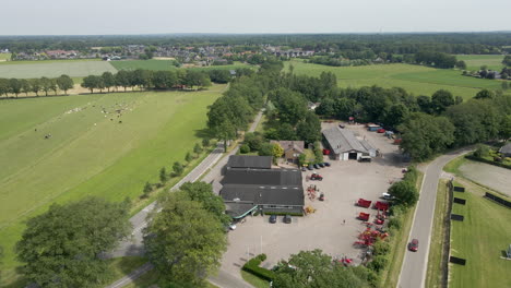 Aerial-of-agricultural-company-with-heavy-machinery-on-lot