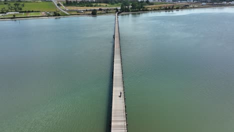 Drone-shot-of-a-cyclist-crossing-the-Fidalgo-Bay-bridge
