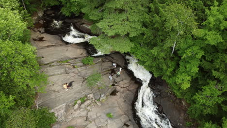 Aerial-Overhead-View-Of-Locals-Relaxing-On-Granite-Rocks-Beside-Stubb's-Falls-In-Arrowhead-Provincial-Park