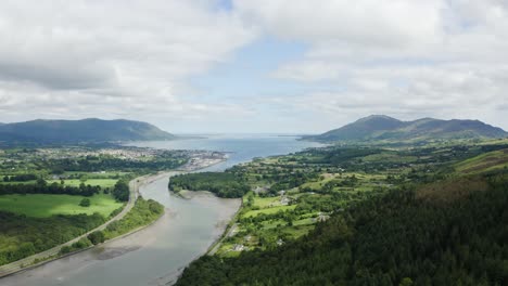 Aerial-flight-of-the-flagstaff-viewpoint-area,-countryside,-Newry,-with-Warrenpoint-town-in-the-distance-during-the-summer