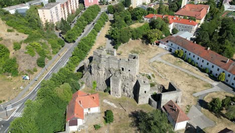 Revealing-drone-establishing-shot-of-Levice-Castle,-Ancient-Hrad-in-Slovakia