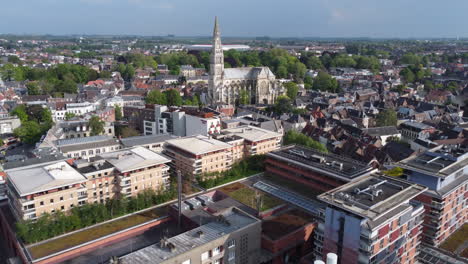 Aerial-flying-towards-Basilica-of-Our-Lady-of-Saint-Cordon,-Valenciennes,-France