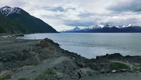 Male-Tourist-On-Rocky-Coastal-Of-Turnagain-Arm-Waterway-On-The-Northwestern-Gulf-Of-Alaska