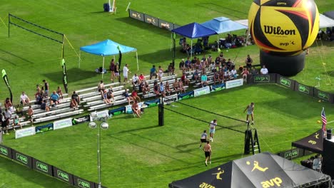 Zoomed-aerial-view-of-Men's-Pro-Open-division-rally-on-AVP-Grass-Tour-main-court