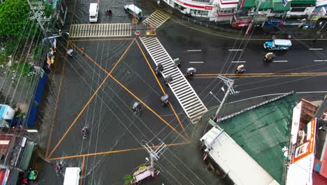 Top-down-aerial-view-rain-water-flooded-the-highways-all-over-the-Dagupan-City,-Philippines