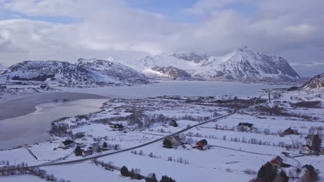 Aerial-of-a-frozen-lake-in-Lofoten-Islands,-Norway