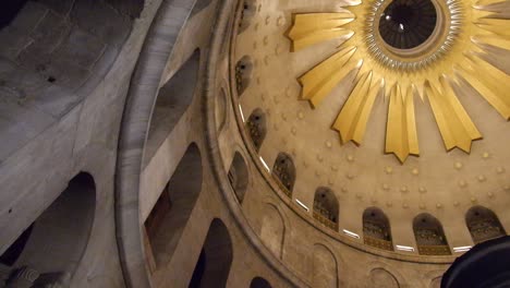 View-looking-up-at-the-ornate-dome-ceiling-above-Jesus-Christ's-empty-tomb-in-the-Church-of-Holy-Sepulchre-in-Jerusalem