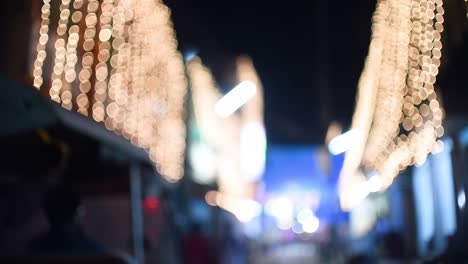 Blurred-light-decorations-on-streets-in-India-for-Christmas-and-Diwali,-slow-motion