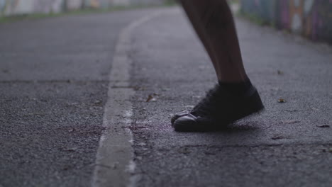 Close-Up-Shot-of-Young-Athletic-Man's-Shoes-Whilst-He's-Jumping-Rope---Skipping-in-an-Underpass---Ungraded