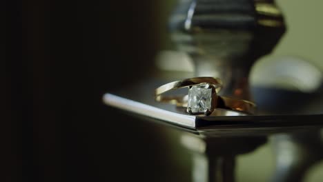 A-slow-pan-of-wedding-rings-staged-in-the-glow-of-the-afternoon-sun