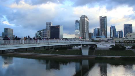 White-Bridge-With-Skyline-And-Skyscrapers-in-the-Capital-City-Vilnius,-Lithuania,-Baltic-States,-Europe