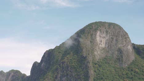 Ultra-slow-motion-shot-of-huge-limestone-cliff-in-daylight-in-El-Nido,-Palawan,-the-Philippines