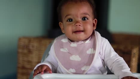 A-baby-very-happy-and-joyful-in-a-highchair
