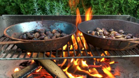 Chestnuts-roasted-on-open-fire,-seasonal-delicacy,-harvest,-4k-UHD