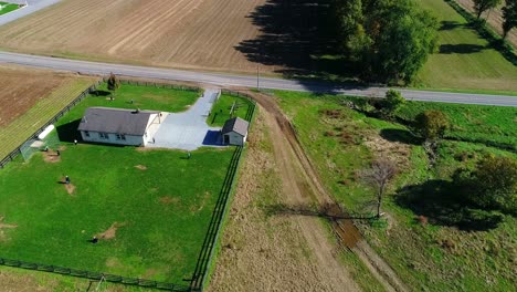 Amish-One-Room-School-House-with-Amish-Children-Playing-Baseball-as-Seen-by-a-Drone