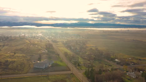 Aerial-drone-footage-of-Alturas,-a-small-town-in-Northern-California,-during-a-beautiful-and-hazy-morning