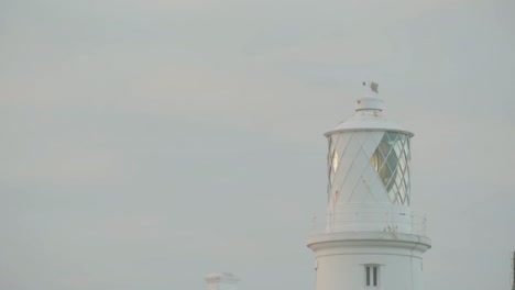 Close-up-view-of-lighthouse-on-cloudy-evening