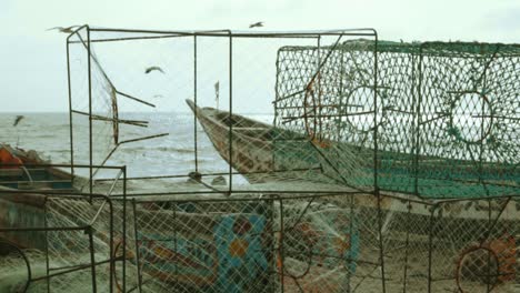 Stock-Video-Footage-Cage-Fish-at-the-beach,-Lobster-Cage