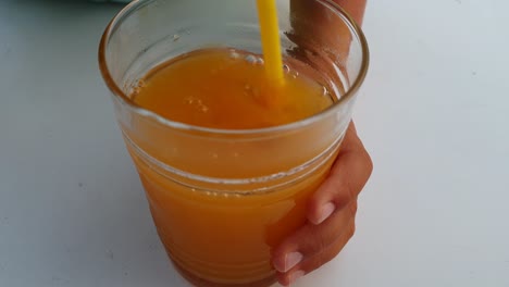 Kids-playing-and-mixing-orange-juice