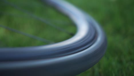 Slowmo---close-up-of-a-bike-wheel-spinning-with-blurred-background