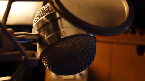 Slow-panning-right-close-up-of-studio-microphone