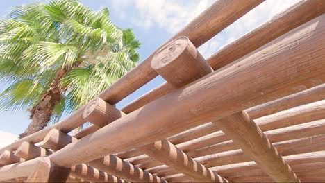 Looking-up-at-a-wooden-sun-roof-at-a-tropical-beach