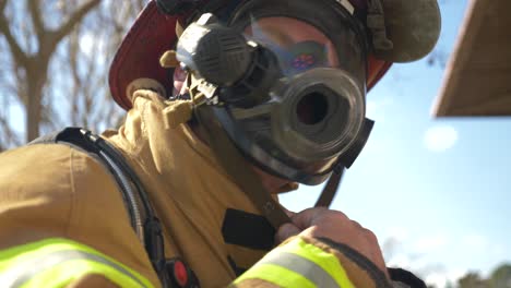 Firefighter-puts-on-firefighting-helmet-to-be-ready-to-fight-a-fire
