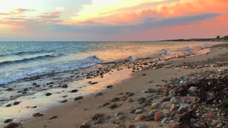 Sand-rocks-at-beach-during-sunrise