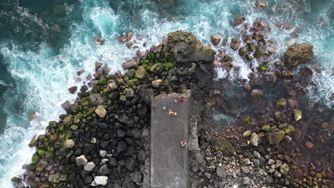 Waves-crashing-against-the-end-a-pier-in-Saint-Pierre,-Reunion-Island