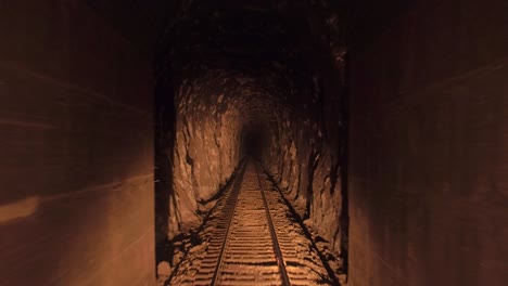 POV-of-a-moving-train-passing-through-a-narrow-tunnel