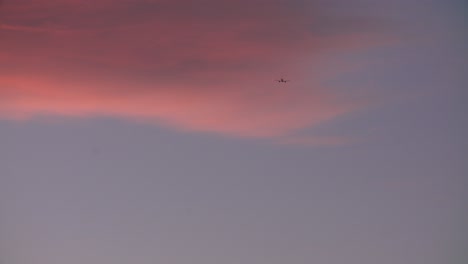 Airplane-after-take-off.-Pink-sky-scene