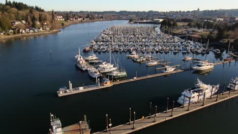 Flying-over-a-marina-at-sunset-in-Olympia-Washington-on-the-Puget-Sound
