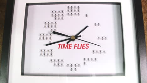 Time-lapse-of-a-clock-and-clock-hands-with-the-saying-printed-on-the-clock,-time-flies