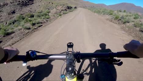 GOPRO-POV-of-mountain-biker-climbing-a-gravel-technical-road