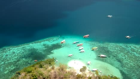 Aerial-fly-over-of-CYC-beach-on-CYC-Island,-Coron-town,-Philippines