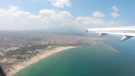 Catania-aerial-view-of-the-city-coast-from-above-on-airplane