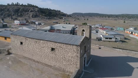 Aerial-shot-of-a-small-Church-in-a-Raramuti-town-in-El-Valle-de-las-Ranas,-Copper-Canyon-Region,-Chihuahua