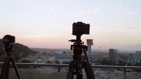 Panning-from-left-to-right-capturing-two-Cameras-capturing-Curacao-International-Airport-when-Dusk-is-Near