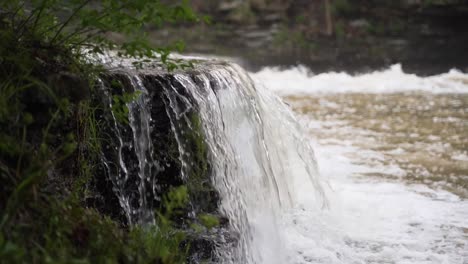 Creek-waterfall-from-the-side-view-in-slow-mo,-25%-speed