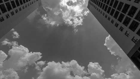 Color-Time-Lapse-of-Residential-Architecture-4k-Black-and-White-Time-Lapse-from-low-angle-looking-up-to-dramatic-clouds-moving-upward-through-the-scene
